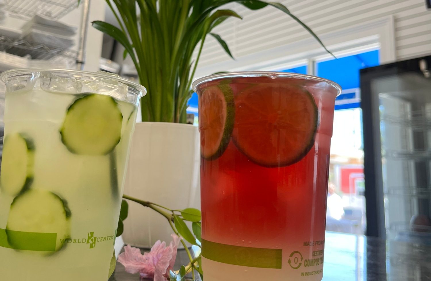 Limeade Two refreshing drinks in clear cups, one with cucumber slices and the other with lime slices.